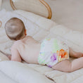 Load image into Gallery viewer, Baby wearing a Reusable Cloth Nappy – Tropical Garden | 2.0 | My Little Gumnut, designed for comfort and everyday movement.