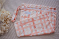 Load image into Gallery viewer, Gingham (Rust) reusable wet bag by My Little Gumnut with secure zip closure