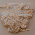 Load image into Gallery viewer, Sandy Blaze reusable wet bag displayed with cloth nappy essentials and accessories 💚