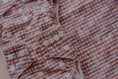 Load image into Gallery viewer, Close-up of Plaid reusable wet bag showing patterned fabric design 💚