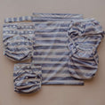 Load image into Gallery viewer, Slate Stripe reusable wet bag displayed with cloth nappy essentials and accessories 💚