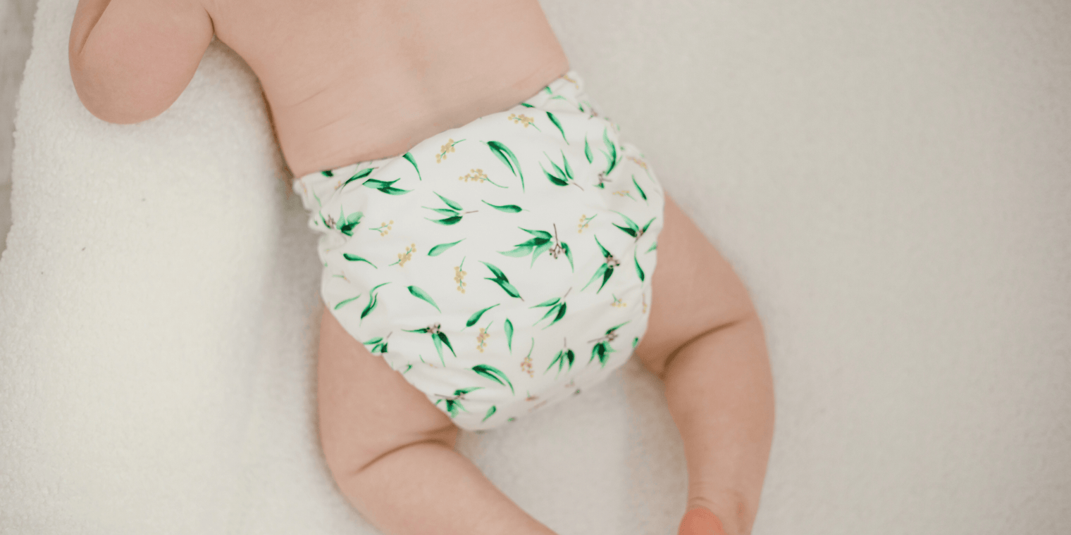 Baby lying on belly with My Little Gumnut Nappy 2.0