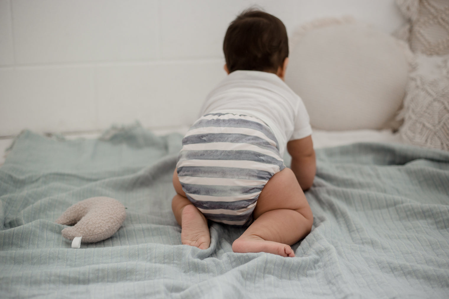 Baby crawling wearing My Little Gumnut Cloth Nappy 2.0