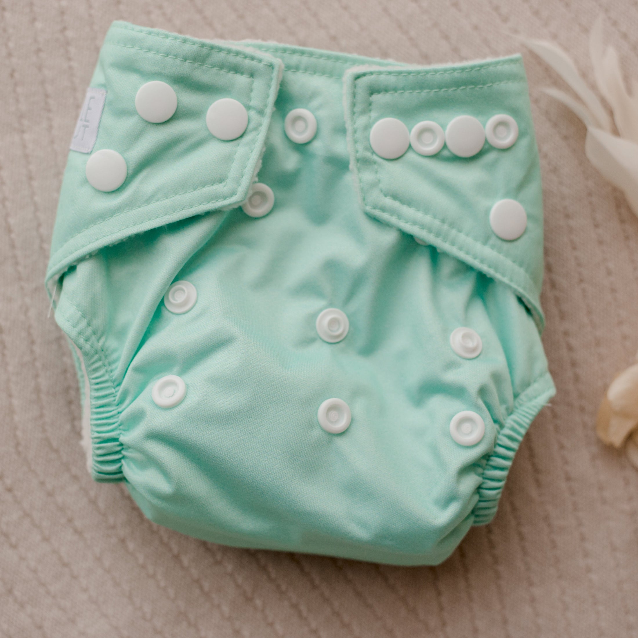 newborn cloth nappy by my little gumnut. austrlian reusable nappy. mint baby nappy.