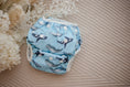 Load image into Gallery viewer, Whales cloth swimming nappy. Reusable swimming nappy. Australian artist design cloth nappy. My little gumnut. 
