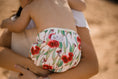Load image into Gallery viewer, beach baby in Flowering gum Australiana swim nappy. Reusable swimming nappy. My little gumnut. 
