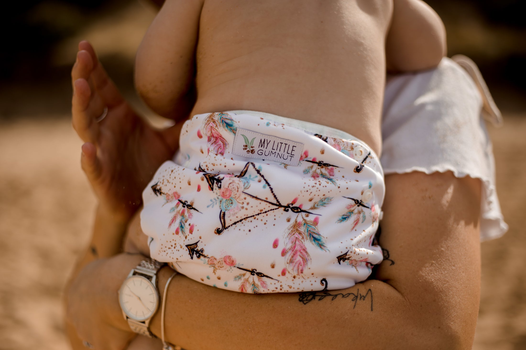 Baby wearing boho princess reusable swimming nappy. Australian designed cloth swimming nappy. My Little Gumnut.