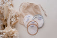 Load image into Gallery viewer, small mesh washing bag by my little gumnut. reusable make up pads. resuable breast pads. 
